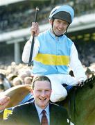 16 March 2004; Jockey Conor O'Dwyer celebrates after winning the Smurfit Champion Hurdle Challenge Trophy on Hardy Eustace during Day One of the Cheltenham Racing Festival at Prestbury Park in Cheltenham, England. Photo by Damien Eagers/Sportsfile