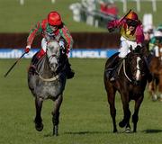 16 March 2004; Fork Lightning, left, with Robert Thornton up, races alongside eventual second place finisher Shardam, with Carl Llewellyn up, on their way to winning the William Hill NH Handicap Chase during Day One of the Cheltenham Racing Festival at Prestbury Park in Cheltenham, England. Photo by Damien Eagers/Sportsfile