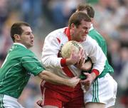 17 March 2004; Dara O'Cinneide of An Gaeltacht in action against Jarlath Murray, left, and Brian Kilroy of Caltra during the AIB All-Ireland Senior Club Football Championship Final between An Gaeltacht and Caltra at Croke Park in Dublin. Photo by Brendan Moran/Sportsfile