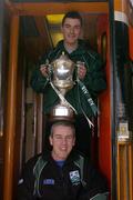 18 March 2004; Caltra manager Frank Doherty, bottom, and captain Noel Meehan with the Tommy Moore Cup, following their AIB All-Ireland Senior Club Football Championship Final Victory over An Gaeltacht, as they await to board a train for Athlone at Heuston Station, Dublin. Photo by Brian Lawless/Sportsfile