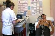 18 March 2004; Shelbourne player Gerard McCarthy being monitored by Theresa Murphy, Chief Cardiac Technician, while receiving an ECG (electrocardiograph) during the Shelbourne squad's visit to the Cardiology department in the Bon Secours hospital in Glasnevin, Dublin. Photo by Brendan Moran/Sportsfile