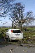 20 March 2004; A car is crushed by a fallen branch of a tree as competitors prepare to tee off at the 1st during the IGO Inn Golf Society Outing at Deer Park Golf Club in Howth, Dublin. Photo by Ray McManus/Sportsfile