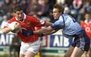 21 March 2004; Fionnan Murray of Cork in action against Paul Griffin of Dublin during the Allianz Football League Division 1A Round 6 match between Dublin and Cork at Parnell Park in Dublin. Photo by Pat Murphy/Sportsfile