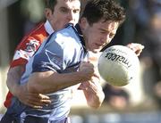 21 March 2004; Declan Lally of Dublin in action against Graham Canty of Cork during the Allianz Football League Division 1A Round 6 match between Dublin and Cork at Parnell Park in Dublin. Photo by Pat Murphy/Sportsfile