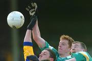 21 March 2004; Pascal Kellaghan, centre, of Offaly, with team-mate Ciaran McManus, right, in action against Seamus O'Neill of Roscommon during the Allianz Football League Division 2A Round 6 match between Offaly and Roscommon at O'Connor Park in Tullamore, Offaly. Photo by David Maher/Sportsfile