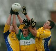 21 March 2004; Seamus O'Neill, left, and Karol Mannion of Roscommon in action against Ciaran McManus of Offaly during the Allianz Football League Division 2A Round 6 match between Offaly and Roscommon at O'Connor Park in Tullamore, Offaly. Photo by David Maher/Sportsfile