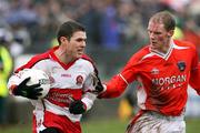 11 March 2007; Gavin Donaghy, Derry, in action against Padraig McCreesh, Armagh. Allianz National Football League, Division 1B Round 4, Armagh v Derry, Oliver Plunkett Park, Crossmaglen, Co. Armagh. Picture credit: Oliver McVeigh / SPORTSFILE