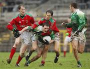 11 March 2007; James Sherry, Fermanagh, is tackled by Mayo players James Nallen, left, and Billy Joe Padden. Allianz National Football League, Division 1A Round 4, Fermanagh v Mayo, St Tighearnach's Park, Clones, Co. Monaghan. Picture credit: Ray McManus / SPORTSFILE
