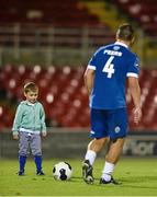 26 September 2014; Caleb Murray, aged 4, son of Cork City's Dan Murray, kicks around with Sligo Rovers captain Gavin Peers after the game. SSE Airtricity League Premier Division, Cork City v Sligo Rovers. Turner's Cross, Cork. Picture credit: Diarmuid Greene / SPORTSFILE
