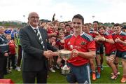 27 September 2014; Munster captain Bill Johnston is presented with the cup by Greg Barrett, IRFU Committee. Under 18 Schools Interprovincial, Munster v Leinster. CBC, Cork. Picture credit: Diarmuid Greene / SPORTSFILE