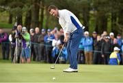 27 September 2014; Graeme McDowell, Team Europe, watches his putt on the 14th green during the afternoon Foursomes Match against Jimmy Walker and Rickie Fowler, Team USA. The 2014 Ryder Cup, Day 2. Gleneagles, Scotland. Picture credit: Matt Browne / SPORTSFILE