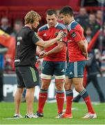 27 September 2014; Munster captain Conor Murray, alongside team-mate CJ Stander, receives some spray on his jersey before the game from scrum coach Jerry Flannery. Guinness PRO12, Round 4, Munster v Ospreys. Thomond Park, Limerick. Picture credit: Diarmuid Greene / SPORTSFILE