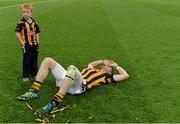 27 September 2014; Kilkenny's Richie Power lies exhausted on the pitch as his son Rory looks on after the game. GAA Hurling All Ireland Senior Championship Final Replay, Kilkenny v Tipperary. Croke Park, Dublin. Picture credit: Brendan Moran / SPORTSFILE
