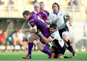 27 September 2014; Darren Cave, Ulster, is tackled by Guglielmo Palazzan, Zebre. Guinness PRO12, Round 4, Zebre v Ulster. Stadio XXV Aprile, Parma, Italy. Picture credit: Roberto Bregani / SPORTSFILE