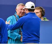28 September 2014; Sir Alex Ferguson shakes hands with Rory McIlroy, Team Europe, before the start of his Singles Match against Rickie Fowler, Team USA. The 2014 Ryder Cup, Final Day. Gleneagles, Scotland. Picture credit: Matt Browne / SPORTSFILE