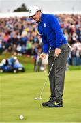 28 September 2014; Rory McIlroy, Team Europe, watches his birdie putt on the first hole during his Singles Match against Rickie Fowler, Team USA. The 2014 Ryder Cup, Final Day. Gleneagles, Scotland. Picture credit: Matt Browne / SPORTSFILE