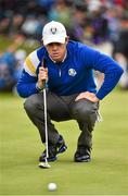 28 September 2014; Rory McIlroy, Team Europe, lines up his birdie putt on the first green during his Singles Match against Rickie Fowler, Team USA. The 2014 Ryder Cup, Final Day. Gleneagles, Scotland. Picture credit: Matt Browne / SPORTSFILE