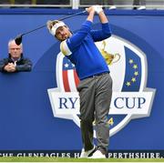 28 September 2014; Victor Dubuisson, Team Europe, watches his tee shot from the first during his Singles Match against  Zach Johnson, Team USA. The 2014 Ryder Cup, Final Day. Gleneagles, Scotland. Picture credit: Matt Browne / SPORTSFILE