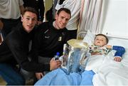 27 September 2014; Kilkenny players Cillian Buckley, left, and Kieran Joyce with Juda Nevin, age 6, from Knocklyon, Co. Dublin. Victorious Kilkenny Champions visit Our Lady's Children Hospital. Our Lady's Children Hospital, Crumlin, Co Dublin. Picture credit: Pat Murphy / SPORTSFILE