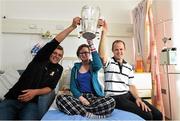 27 September 2014; Margeret Nolan, aged 14, from Athy, Co. Kildare, with Kilkenny players Padraig Walsh, left, and Tommy Walsh and Killian Buckley. Victorious Kilkenny Champions visit Our Lady's Children Hospital. Our Lady's Children Hospital, Crumlin, Co Dublin. Picture credit: Pat Murphy / SPORTSFILE