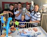 27 September 2014; Kilkenny players, from left, Padraig Walsh, Cillian Buckley, Colin Fennelly, Eoin Larkin and Tommy Walsh with Cillian Glynn, aged 7 months, and his brother Liam Glynn. Victorious Kilkenny Champions visit Our Lady's Children Hospital. Our Lady's Children Hospital, Crumlin, Co Dublin. Picture credit: Pat Murphy / SPORTSFILE