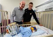 27 September 2014; Kilkenny manager Brian Cody and captain Lester Ryan with twelve week old Danny Molloy, from Tipperary. Victorious Kilkenny Champions visit Our Lady's Children Hospital. Our Lady's Children Hospital, Crumlin, Co Dublin. Picture credit: Pat Murphy / SPORTSFILE