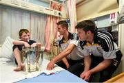 27 September 2014; Kilkenny players Colin Fennelly, left, and Michael Rice with nine year old Reece Kelly, age 9, from Shankill, Dublin. Victorious Kilkenny Champions visit Our Lady's Children Hospital. Our Lady's Children Hospital, Crumlin, Co Dublin. Picture credit: Pat Murphy / SPORTSFILE