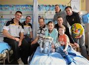 27 September 2014; Kilkenny players, from left, Colin Fennelly, Eoin Larkin, Tommy Walsh, Lester Ryan, Walter Walsh and Kieran Joyce with Saoirse MacDonald and Finn Thyssen. Victorious Kilkenny Champions visit Our Lady's Children Hospital. Our Lady's Children Hospital, Crumlin, Co Dublin. Picture credit: Pat Murphy / SPORTSFILE