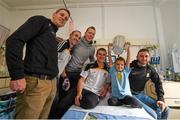 27 September 2014; Kilkenny players, from left, Lester Ryan, Eoin Larkin, Walter Walsh, Eoin Murphy and Conor Fogarty with eight year old Sofia Larionova O'Connor, age 8, from Dublin. Victorious Kilkenny Champions visit Our Lady's Children Hospital. Our Lady's Children Hospital, Crumlin, Co Dublin. Picture credit: Pat Murphy / SPORTSFILE
