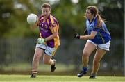 27 September 2014; Krystal Campbell, St. Lawrences, Lancashire, in action against, Eva Gomez Campelo, Europe. 2014 TESCO HomeGrown All-Ireland Ladies Football Club Sevens Finals. Naomh Mearnóg GAA Club, Portmarnock, Co. Dublin. Picture credit: Barry Cregg / SPORTSFILE