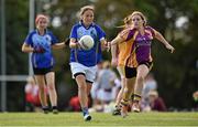 27 September 2014; Maria Lee, Europe, in action against, Sarah Cearns, St. Lawrences, Lancashire. 2014 TESCO HomeGrown All-Ireland Ladies Football Club Sevens Finals. Naomh Mearnóg GAA Club, Portmarnock, Co. Dublin. Picture credit: Barry Cregg / SPORTSFILE
