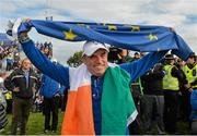 28 September 2014; European team captain Paul McGinley celebrates with the European and Irish flags after Europe won the Ryder Cup. The 2014 Ryder Cup, Final Day. Gleneagles, Scotland. Picture credit: Matt Browne / SPORTSFILE