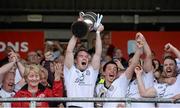 28 September 2014; Omagh St. Enda’s captain Hugh Gallegher lifts the O'Neill cup. Tyrone County Senior Football Championship Final, Carrickmore Naomh Colmcille v Omagh St. Enda’s, Healy Park, Omagh, Co. Tyrone. Picture credit: Oliver McVeigh / SPORTSFILE