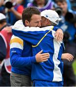 28 September 2014; Graeme McDowell, left, Team Europe, receives a hug from team captain Paul McGinley after he won his match against Jordan Spieth, Team USA, on the 17th green. The 2014 Ryder Cup, Final Day. Gleneagles, Scotland. Picture credit: Matt Browne / SPORTSFILE
