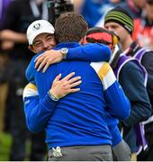 28 September 2014; Graeme McDowell, Team Europe, receives a hug from Rory McIlroy after he won his match against Jordan Spieth,  Team USA, on the 17th green. The 2014 Ryder Cup, Final Day. Gleneagles, Scotland. Picture credit: Matt Browne / SPORTSFILE