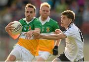 28 September 2014; Mark Donnelly, Carrickmore Naomh Colmcille, in action against Aaron Grugan, Omagh St. Enda’s. Tyrone County Senior Football Championship Final, Carrickmore Naomh Colmcille v Omagh St. Enda’s, Healy Park, Omagh, Co. Tyrone. Picture credit: Oliver McVeigh / SPORTSFILE