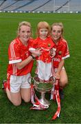 28 September 2014; Cork captain Briege Corkery, left, with her sister Mairead, right, and their niece Bridgín, with the Brendan Martin Cup. TG4 All-Ireland Ladies Football Senior Championship Final, Cork v Dublin. Croke Park, Dublin. Picture credit: Brendan Moran / SPORTSFILE