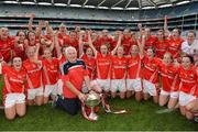 28 September 2014; Cork manager Eamon Ryan and the team celebrate with the Brendan Martin Cup after the game. TG4 All-Ireland Ladies Football Senior Championship Final, Cork v Dublin. Croke Park, Dublin. Picture credit: Brendan Moran / SPORTSFILE