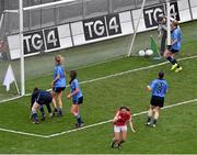 28 September 2014; Eimear Scally turns to celebrate after shooting past Dublin defenders Leah Caffrey, Rachel Ruddy and goalkeeper Clíodhna O'Connor to score a late goal for Cork. TG4 All-Ireland Ladies Football Senior Championship Final, Cork v Dublin. Croke Park, Dublin. Picture credit: Ray McManus / SPORTSFILE