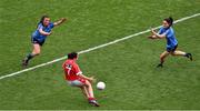 28 September 2014; Geraldine O'Flynn shoots past Dublin's Leah Caffrey, left, and captain Sinéad Goldrick to score what proved to be the winning point for Cork. TG4 All-Ireland Ladies Football Senior Championship Final, Cork v Dublin. Croke Park, Dublin. Picture credit: Ray McManus / SPORTSFILE
