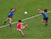 28 September 2014; Geraldine O'Flynn shoots past Dublin's Leah Caffrey, left, and captain Sinéad Goldrick to score what proved to be the winning point for Cork. TG4 All-Ireland Ladies Football Senior Championship Final, Cork v Dublin. Croke Park, Dublin. Picture credit: Ray McManus / SPORTSFILE