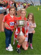 28 September 2014; Cork's Angela Walsh with her nieces Lauren, left, and Ciara Walsh and the Brendan Martin Cup after the game. TG4 All-Ireland Ladies Football Senior Championship Final, Cork v Dublin. Croke Park, Dublin. Picture credit: Brendan Moran / SPORTSFILE