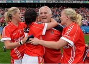 28 September 2014; Cork manager Eamonn Ryan celebrates with  Angela Walsh, left, Geraldine O'Flynn and Deirdre O'Reilly, right, after the game. TG4 All-Ireland Ladies Football Senior Championship Final, Cork v Dublin. Croke Park, Dublin. Picture credit: Brendan Moran / SPORTSFILE