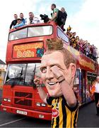 27 September 2014; Kilkenny supporter Conor Dwyer wearing a Henry Shefflin mask celebrates as the team bus makes its way to Nowlan Park during the homecoming celebrations. All Ireland Hurling Champions return to Kilkenny. Kilkenny Picture credit: Pat Murphy / SPORTSFILE