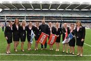 28 September 2014; Members of the Ireland Women's rugby team, including Nora Stapleton, Mary Louise Reilly, Orla Fitzsimons, Paula Fitzpatrick, Fiona Coghlan, Niamh Briggs, Lynne Cantwell and Jenny Murphy, alongside  MC Dáithí Ó Sé, are introduced to the crowd at half-time. TG4 All-Ireland Ladies Football Senior Championship Final, Cork v Dublin. Croke Park, Dublin. Picture credit: Ramsey Cardy / SPORTSFILE