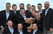 28 September 2014; The European Ryder Cup team, back row, from left, Henrik Stenson, Stephen Gallacher, Lee Westwood, Rory McIlroy, Ian Poulter, Martin Kaymer, Victor Dubuisson, captain Paul McGinley, Justin Rose, and Thomas Björn. Front row, from left Jamie Donaldson, Graeme McDowell and Sergio Garcia celebrate with the Ryder Cup. The 2014 Ryder Cup, Final Day. Gleneagles, Scotland. Picture credit: Matt Browne / SPORTSFILE