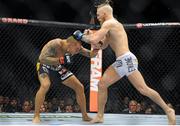 27 September 2014; Conor McGregor, right, in action against Dustin Poirier. UFC 178, Dustin Poirier v Conor McGregor, MGM Grand Garden Arena, Las Vegas, Nevada, USA. Picture credit: Stephen R. Sylvanie / SPORTSFILE