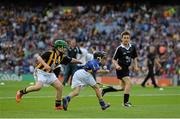 27 September 2014; Diarmuid Brennan, Carrig National School, Birr, Co. Offaly, representing Tipperary, in action against Gavin Fennessy, Ratoath National School, Ratoath, Co. Meath, representing Kilkenny, during the INTO/RESPECT Exhibition GoGames. Croke Park, Dublin. Picture credit: Brendan Moran / SPORTSFILE