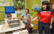 29 September 2014; Four year old Bernard Kearney with Cork footballer Norita Kelly and the Brendan Martin Cup during a visit to Temple Street Childrens Hospital, Dublin. Photo by Sportsfile