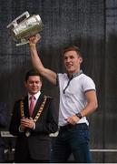 27 September 2014; Kilkenny's Cillian Buckley lifts the Liam MacCarthy Cup. All Ireland Hurling Champions return to Kilkenny. Kilkenny Picture credit: Pat Murphy / SPORTSFILE
